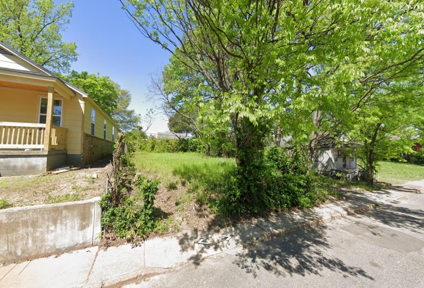 Level lot featuring mature trees and street frontage