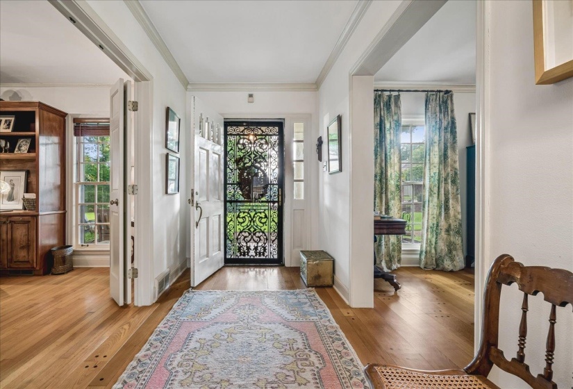 Bright entryway featuring hardwood flooring and a decorative security door