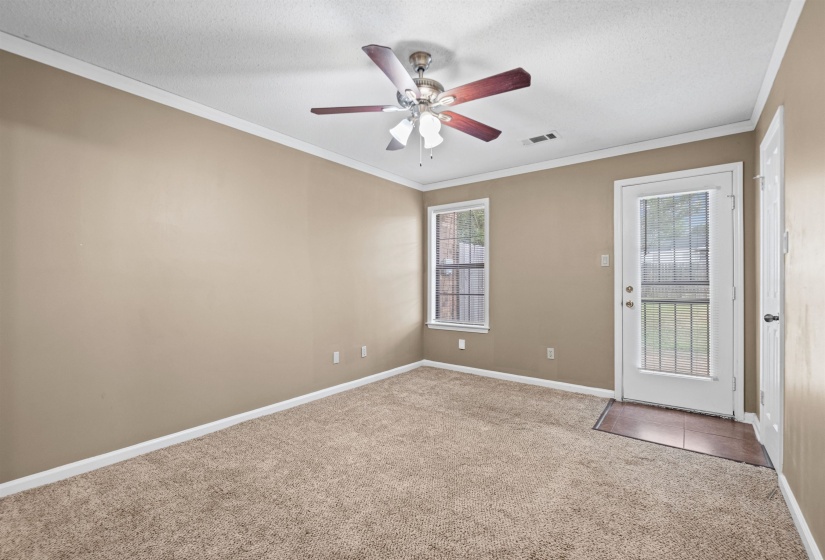 Neutral-toned walls complement plush carpeting