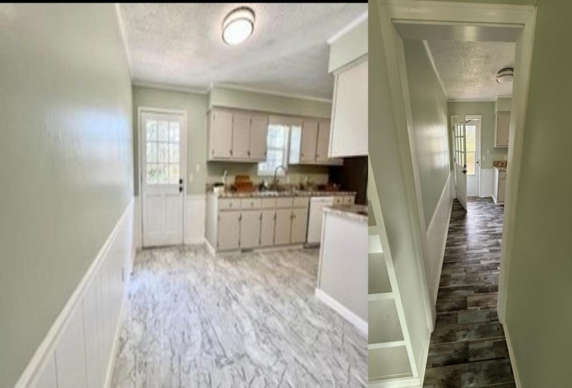 Open kitchen and dining area featuring light wood-finish flooring and wainscoting