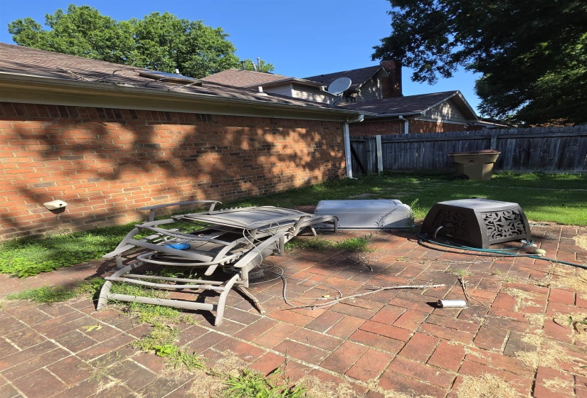 Brick patio with a herringbone pattern