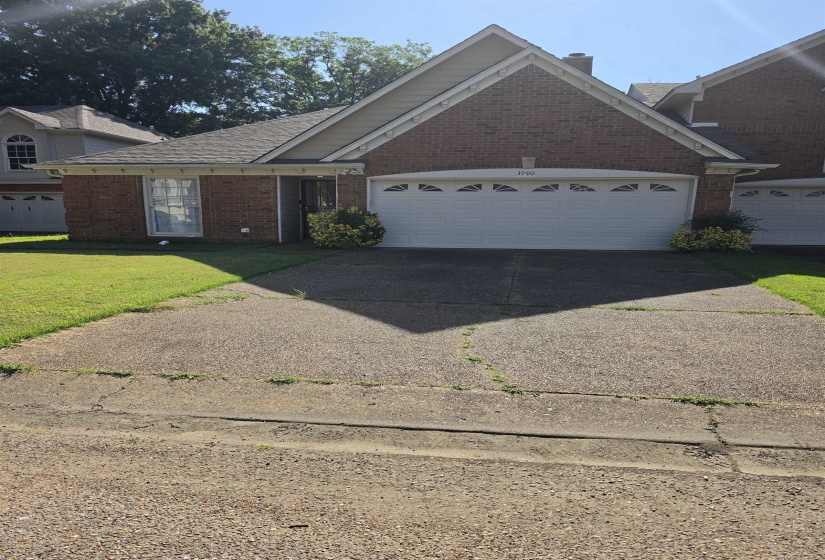 Brick exterior with a peaked gable roofline