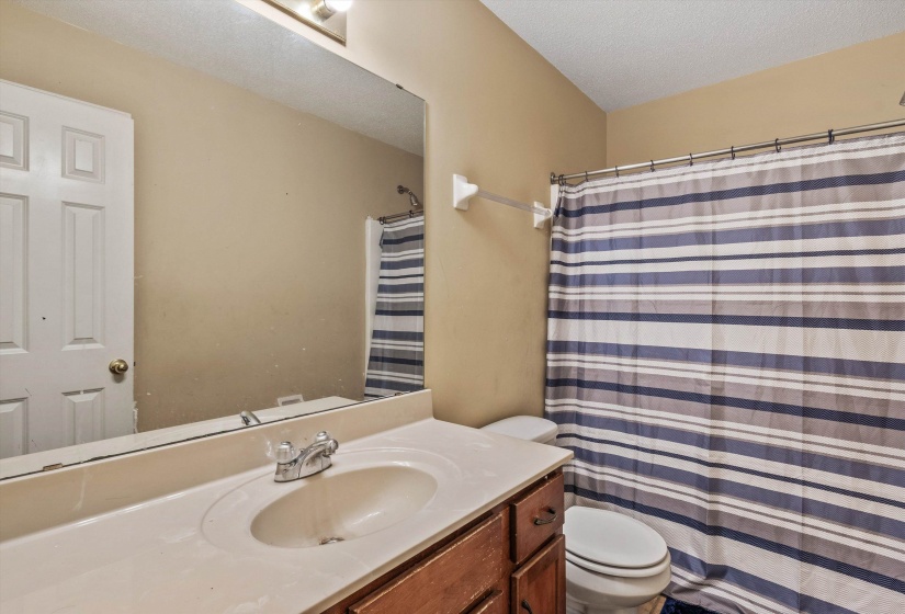 Bathroom vanity with an integrated sink and base cabinetry