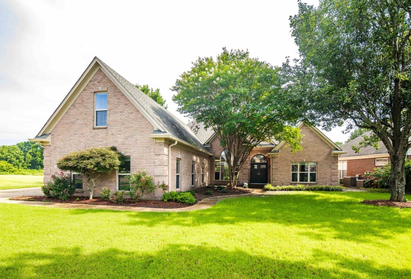 Traditional brick exterior featuring a prominent gabled roofline