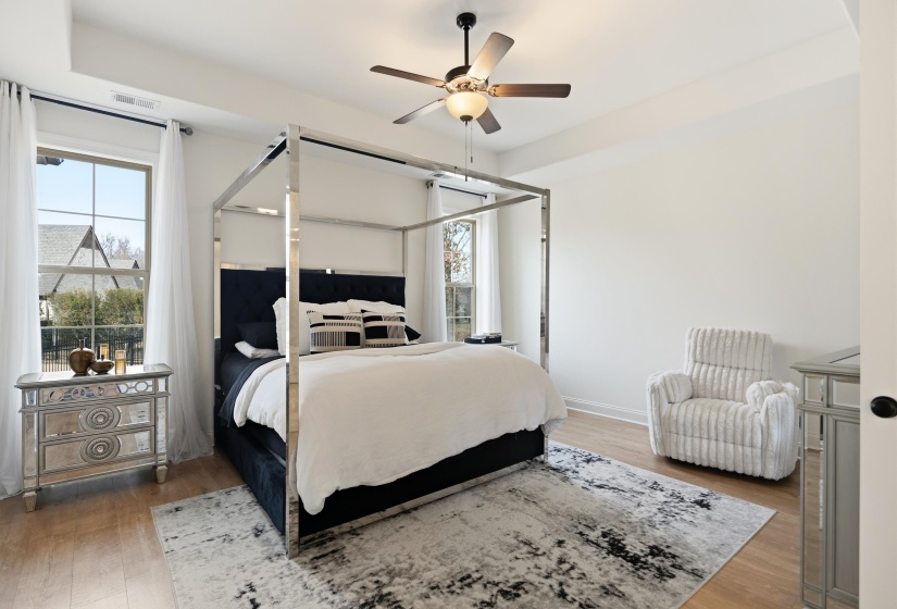 Bedroom featuring light wood-style flooring and a ceiling fan