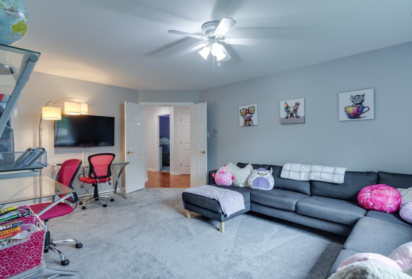 Carpeted room featuring a ceiling fan, recessed lighting, and light gray walls