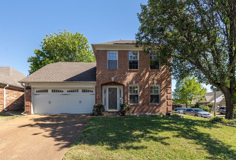 Brick exterior with a gabled roof and white trim