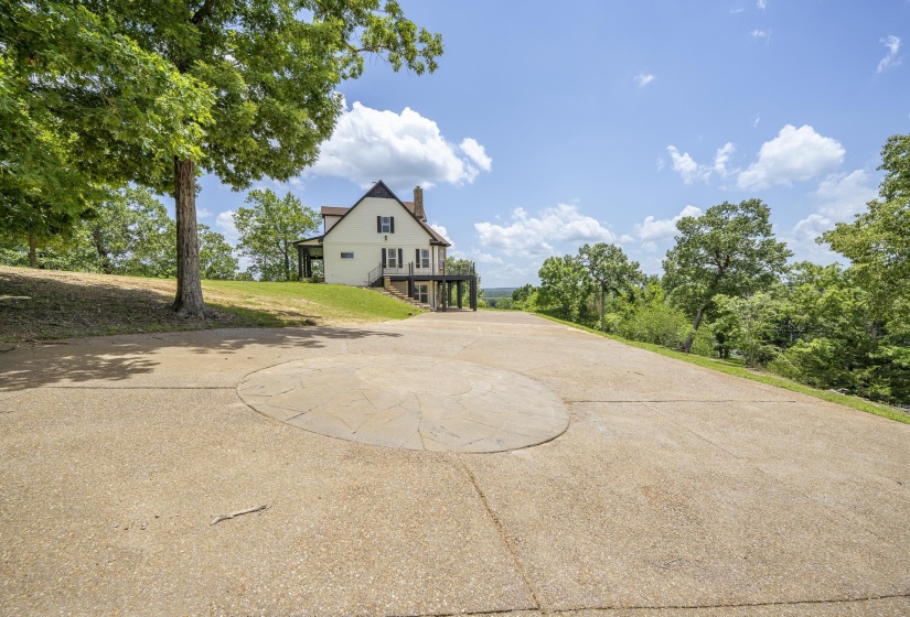 Expansive concrete driveway with a central circular design