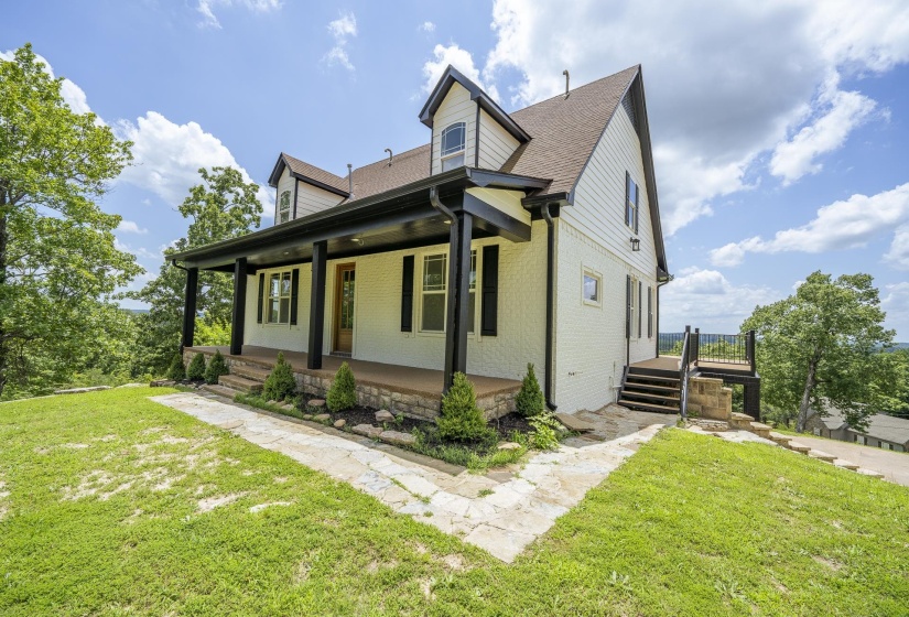White brick and siding exterior with black trim accents