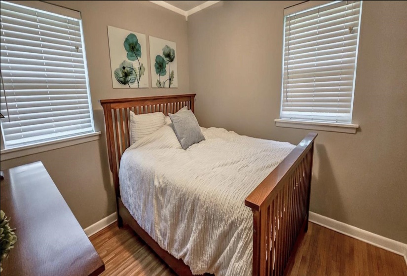Neutral-toned walls complement wood-finish flooring