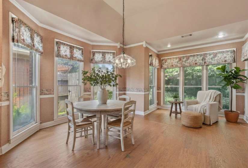 BREAKFAST ROOM (11x11) – Charming bay-windowed breakfast area with adjoining 10x07 SITTING NOOK, offering the perfect spot to enjoy morning coffee while overlooking the backyard. Virtually staged photo.