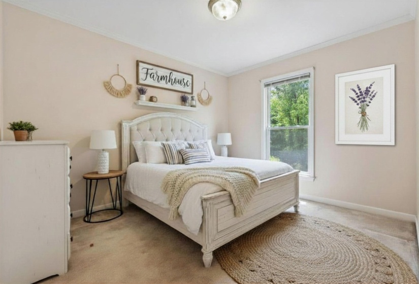 BEDROOM 2 (13x9) – Comfortable secondary bedroom with carpet flooring and easy access to the hall bath.   Virtually staged photo.