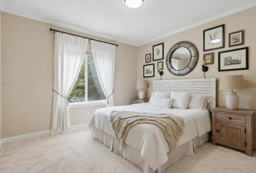 BEDROOM 3 (13x10) – Nicely sized bedroom with carpet flooring and double closet, ideal for family, guests, or a home office. Virtually staged photo.