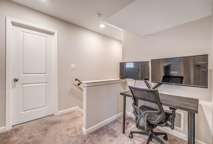 Office featuring light carpet and recessed lighting