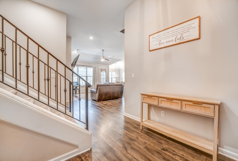 Hallway featuring wood finished floors and recessed lighting
