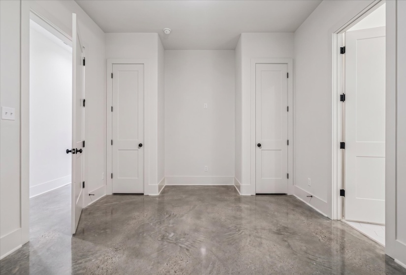 Polished concrete flooring complemented by clean white walls and matching trim