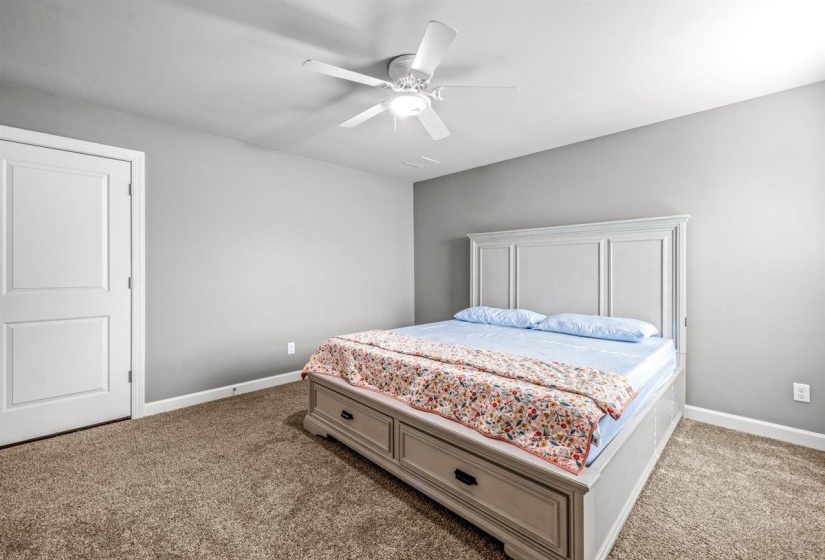 Bedroom featuring neutral wall colors and carpeted flooring