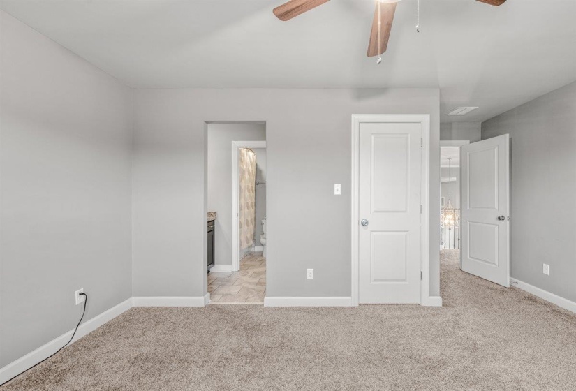 Neutral-toned carpeting paired with light gray walls