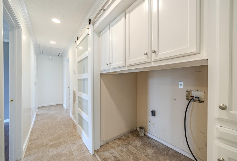Hallway featuring recessed lighting and tile flooring