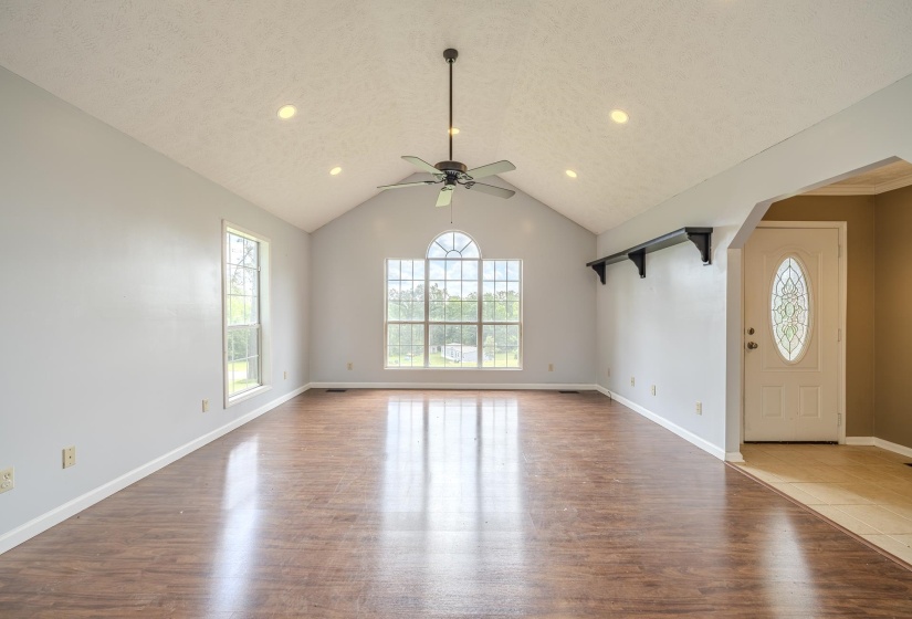 Vaulted ceiling featuring a ceiling fan and recessed lighting