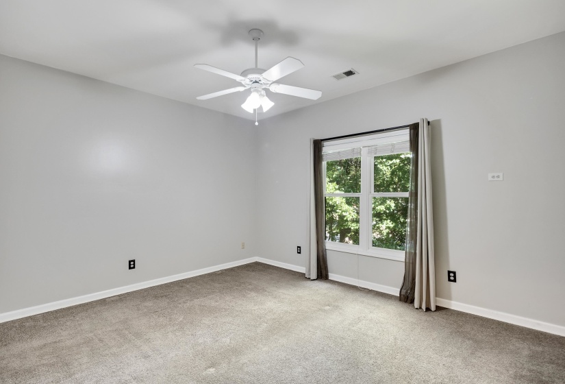 Room featuring neutral carpet, light gray wall paint, and white trim