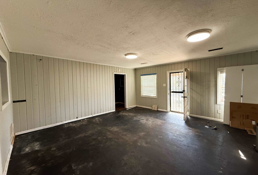Foyer with a textured ceiling and concrete floors