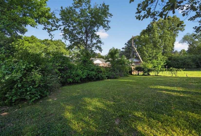 View of yard featuring view of wooded area