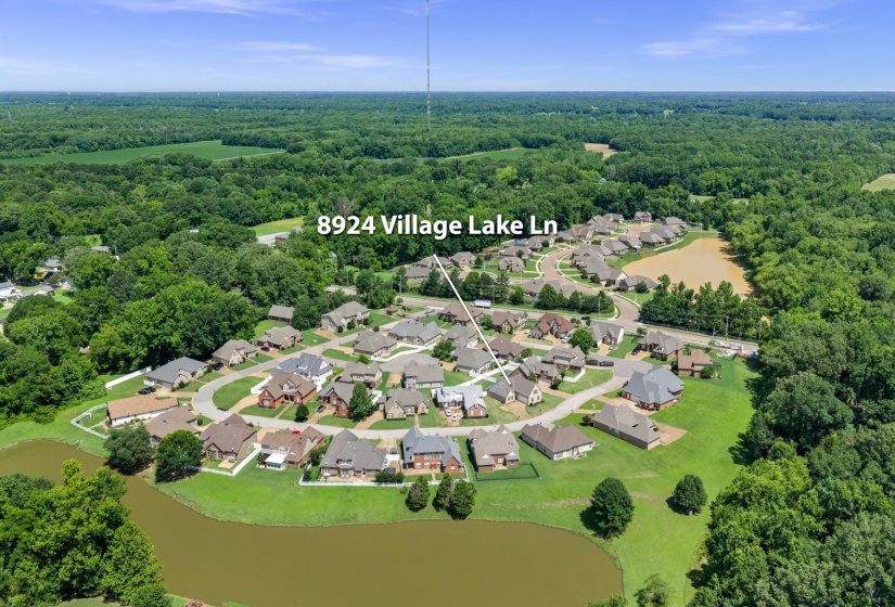 Aerial perspective showcasing a residential community with numerous homes