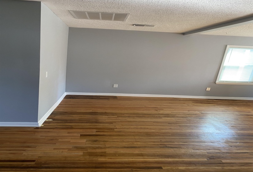 Hardwood flooring extending throughout the room