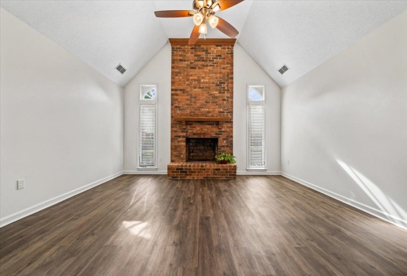 Beautiful, vaulted Great Room (12' at apex) with fireplace.