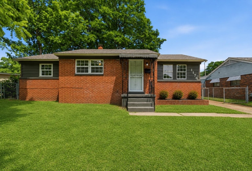 Brick exterior with dark gray siding accents
