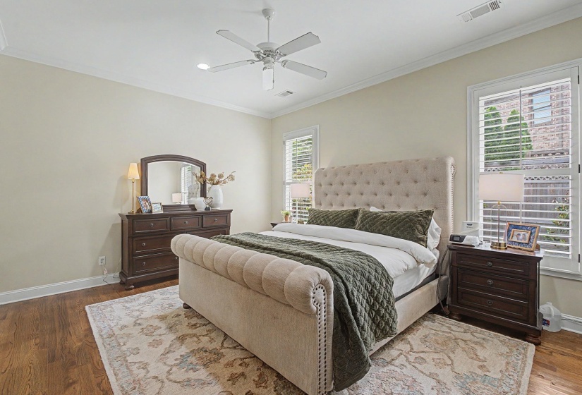 Hardwood-finish flooring complementing light wall tones and crown molding