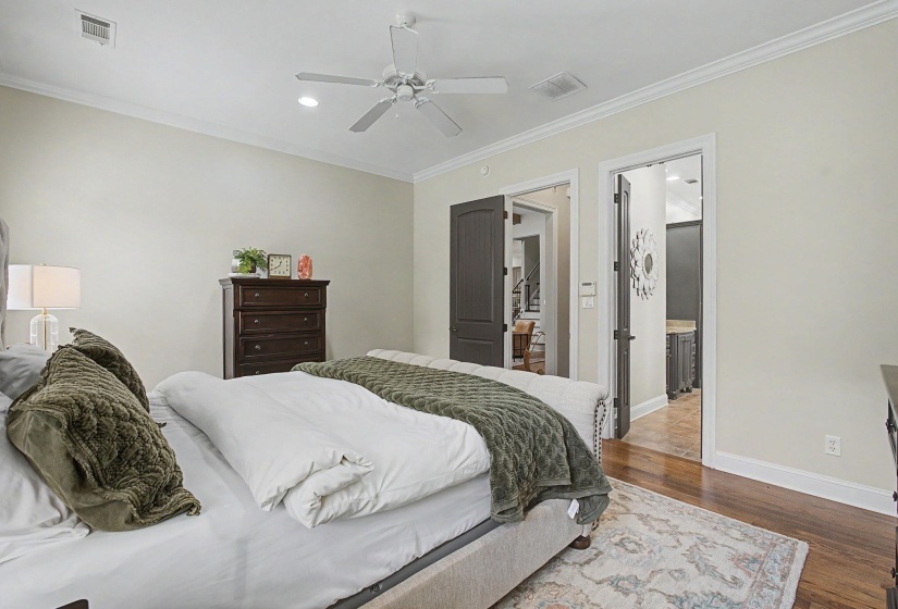 Bedroom with wood-finish flooring, recessed lighting, and a ceiling fan