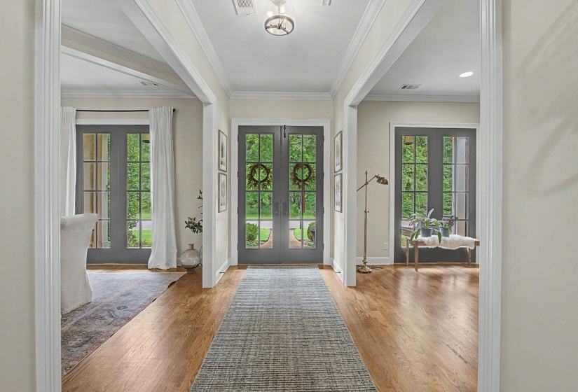 Entryway featuring wood-finish flooring, recessed lighting, and a central ceiling light fixture