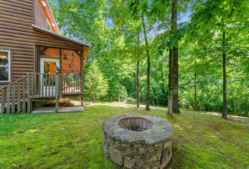 Wood-sided cabin exterior featuring a covered porch with wooden railings