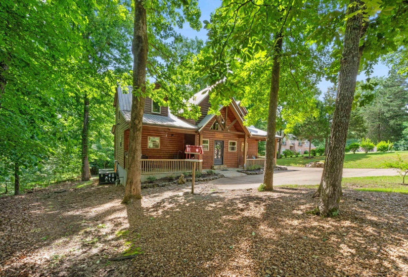 Wood-sided home with a metal roof and front porch
