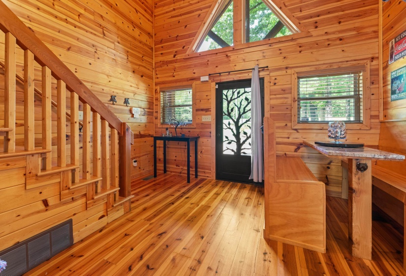Expansive wood-finish flooring and walls provide a cohesive aesthetic