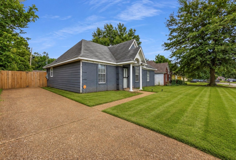Traditional-style home featuring gray siding and white trim