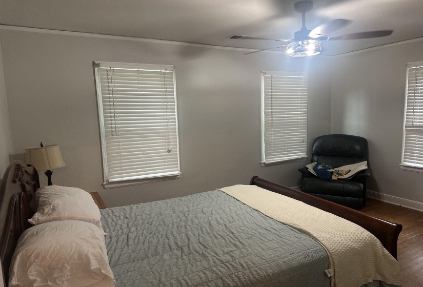 Room with light gray walls and wood-finish flooring