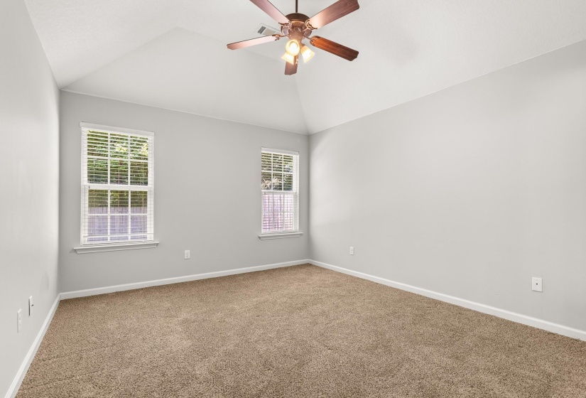 Vaulted ceiling featuring a ceiling fan with integrated lighting