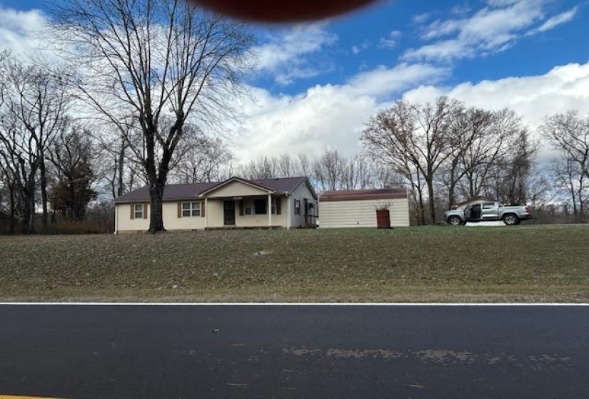 Single story home with a front yard