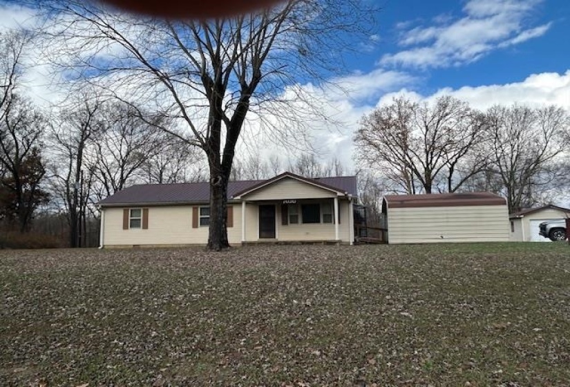Ranch-style home with an outbuilding and crawl space