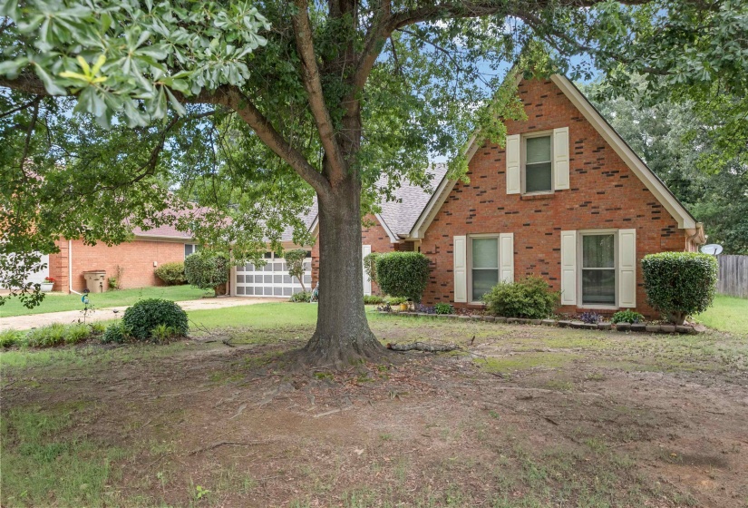 Brick exterior with white shutters and an A-frame roofline