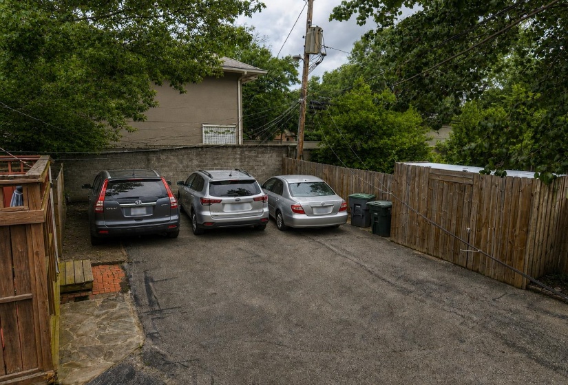 AI rendering removing the tree and bush so 3 cars can be accommodated