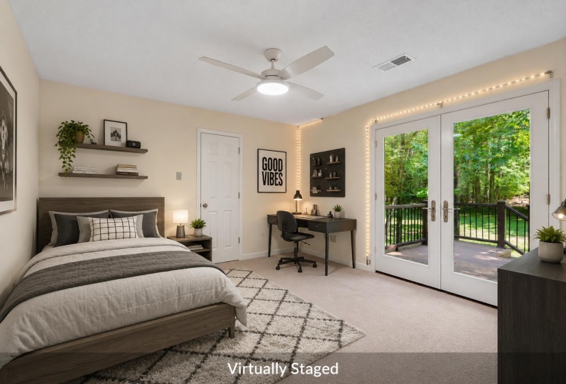 Double French doors opening to an outdoor deck