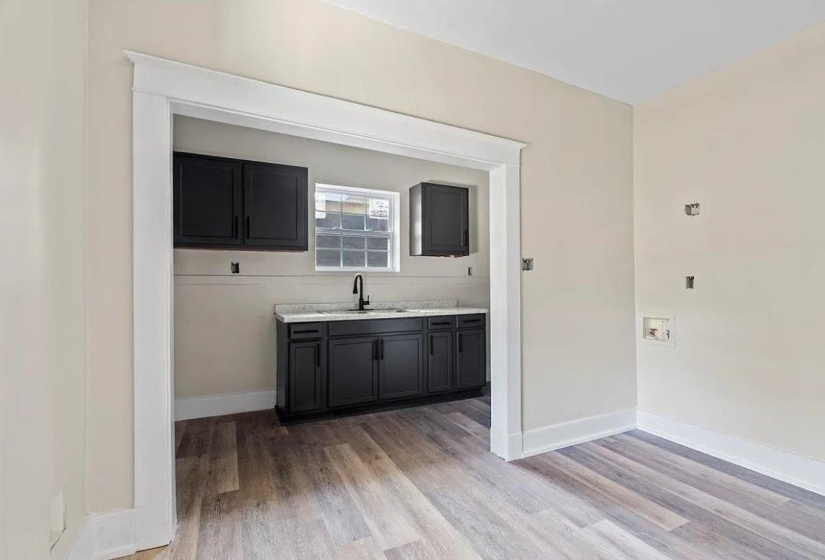 Interior space featuring wood-finish flooring and light-toned walls