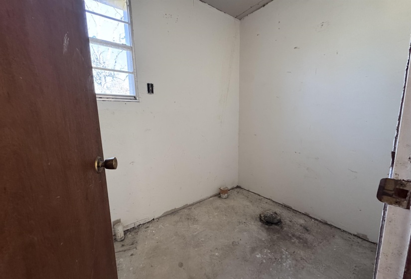 Bathroom with unfinished concrete floors