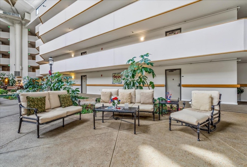 Multi-level atrium featuring high ceilings and balcony walkways