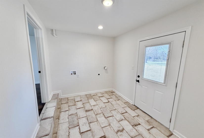 Laundry area featuring tile floor, backdoor, washer hookup and hookup for an electric dryer