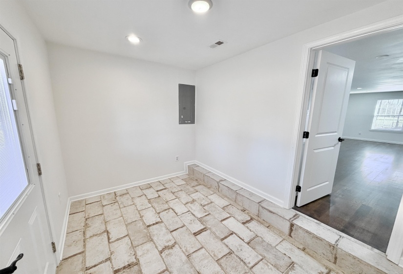 Pantry and Laundry area featuring tile floor, backdoor, washer hookup and hookup for an electric dryer